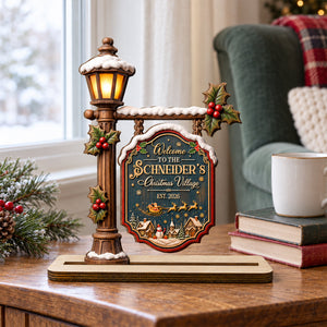 Christmas village wood plaque by the window