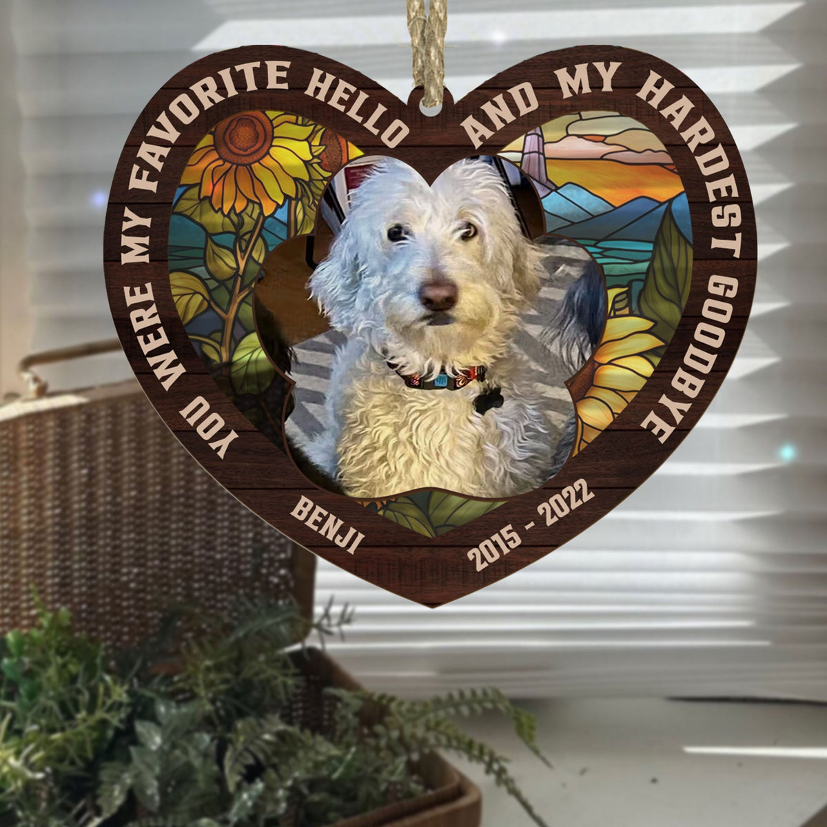 Heart shaped photo suncatcher hanging in a window