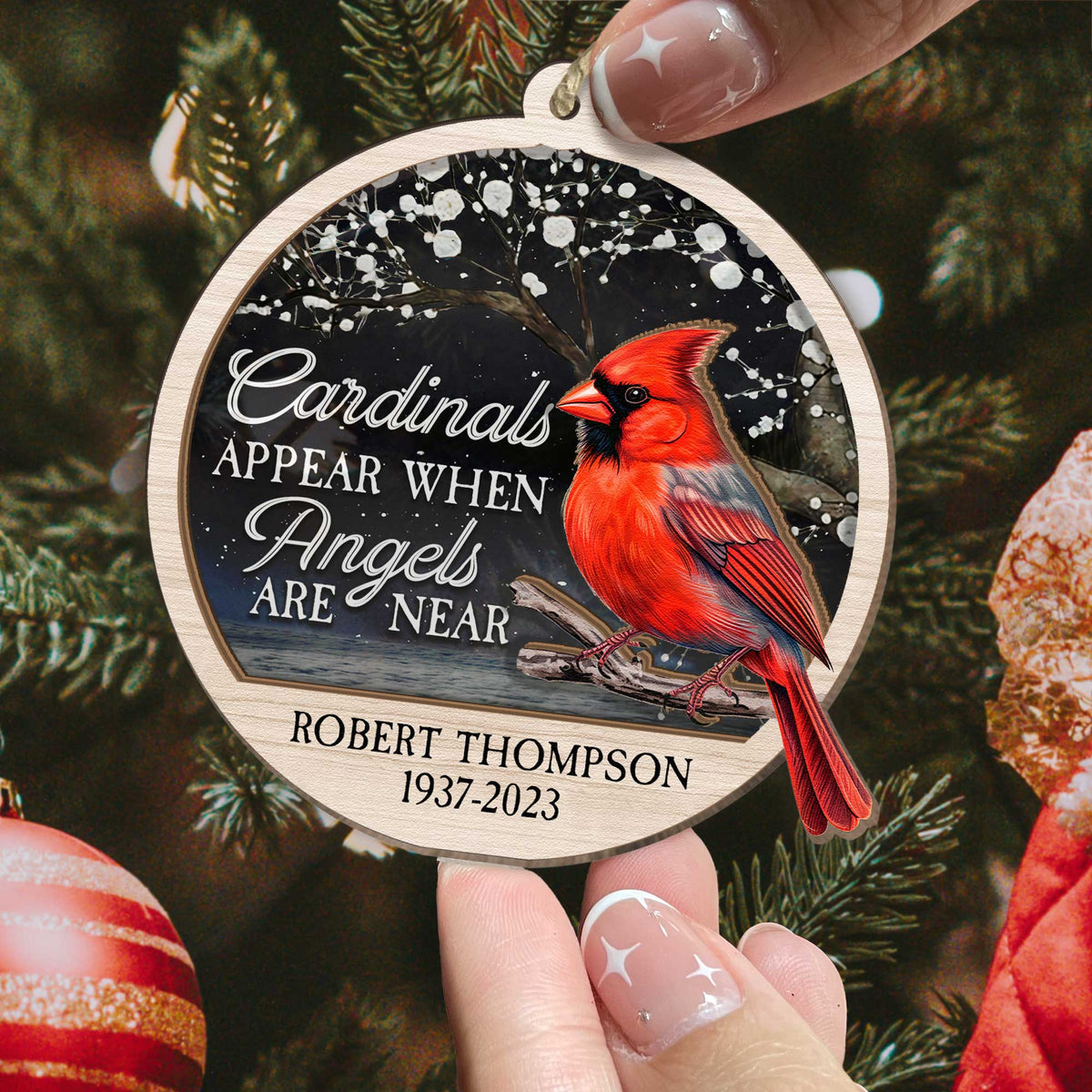 Cardinal suncatcher ornament hanging in a window