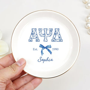 Alpha Psi Delta Est, Floral Greek Letters And Bow Ceramic Dish - Personalized Custom Jewelry Dish, Ceramic Dish, Round Shape - GRAD474_RCRF