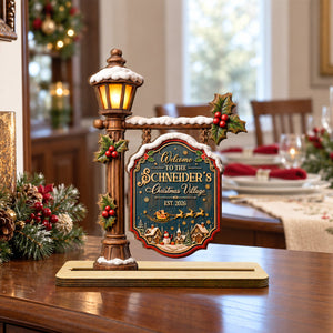 Christmas village wood plaque on a dining table